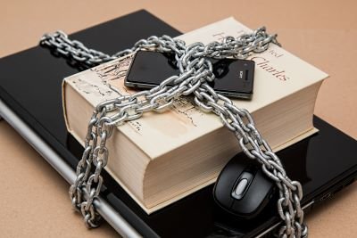 Laptop and smartphone in chains for protection