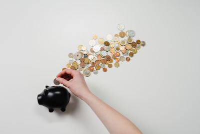 Piggy bank shows cost of new bookkeeper