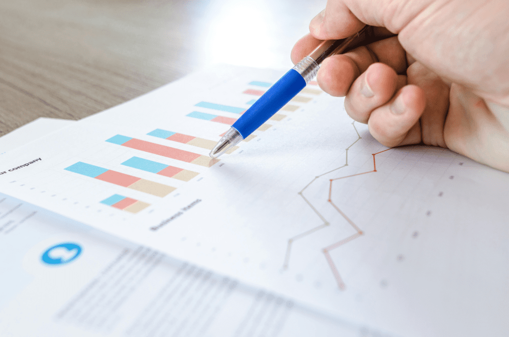 Graphs showing an upward trend in growth and sales.
